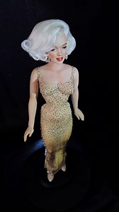 5.7K views · 10K reactions | A woman who needs no introduction. Marilyn Monroe. This piece was a commission. #marilynmonroe #marilynmonroemoment #hollywoodicon #ooakdolls #marilynmonroefans #luxuriousdolls #marilynmonroedoll #preciosacrystals #nalladris #jeanlouisdesigner #happybirthday #happybirthdaymrpresident #customdollartist #customdollcollector #archeslondonbridge #iconichistory #iconichairstyle #1960sfashion #1960sstyle #historicmoment | Jean Norman Dolls | Facebook