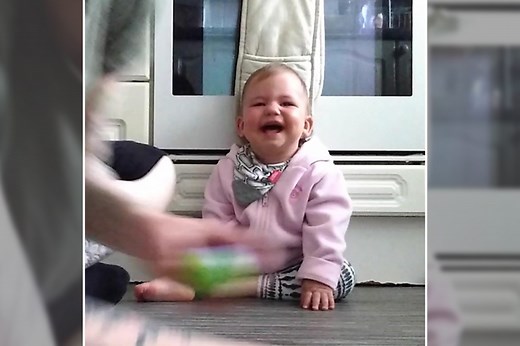 Baby laughing at a ball is the joy you need