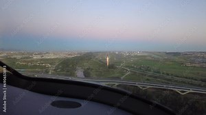 airplane aircraft jet full final approach and landing at airport runway touchdown arriving arrival travel transport cockpit view dusk evening aviation