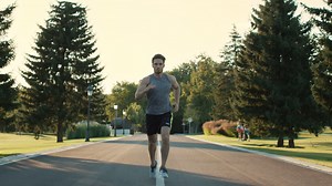 Male runner training to run marathon in park. Sport man exercise outdoor | Premium Stock Video Footage