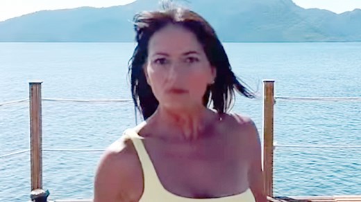 Davina McCall, 54, twerks in a yellow bikini as she reveals incredible figure on holiday