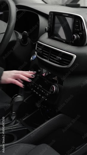 woman turns on and off the emergency stop sign in a black modern interior, emergency stop, flashing, triangle