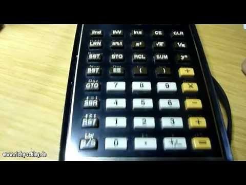 Texas Instruments Ti-57 calculator with universal power supply