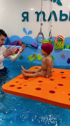 Child's Swimming Lessons in Vibrant Indoor Pool