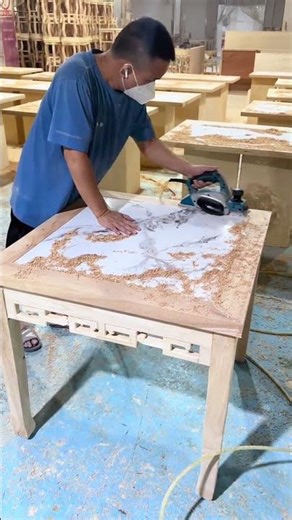 Woodworker Planing a Custom Tabletop with an Electric Planer