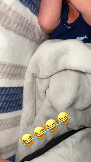 Adorable Baby Snuggled in Cozy Bedroom