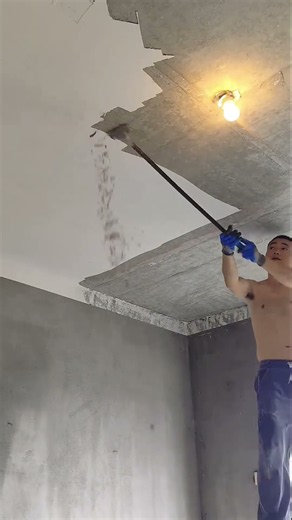 Manual Concrete Ceiling Plaster Removal with Long-Handled Scraper