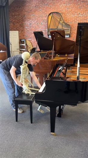 Michael just got the skeleton out of the closet. Upcycle Piano Craft, Fine Pianos for Spooky Music. | Upcycle Piano Craft