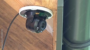 Installing a security camera. Installing a video surveillance camera. Video security.