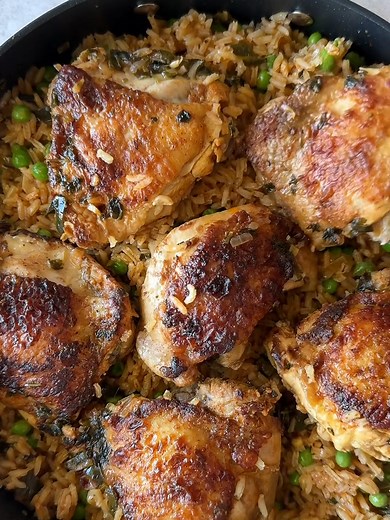 Arroz con pollo made with juicy chicken thighs cooked in flavorful Mexican rice is the ultimate one-pot meal! There are so many variations of this dish, and my version features my mom’s Mexican rice and flavorful chicken thighs all cooked together to create a really easy and delicious dinner that literally everyone in my family loves. I used bone-in skin-on chicken thighs as it adds the most flavor, but you could use boneless skinless if you prefer. Get the full recipe at my @isabeleatsblog prof