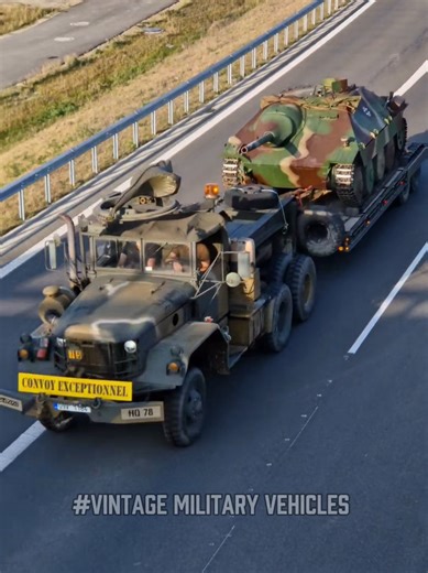 Military tractor REO with Hetzer G13 on empty highway | tractor