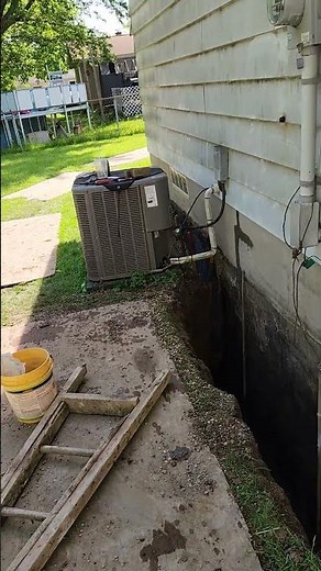 basement waterproofing hydraulic cement applied then thick tar + visqueen + pea stone