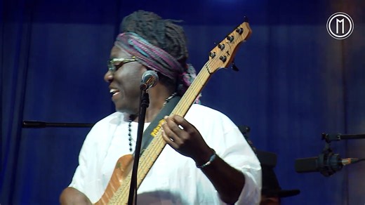 Happy 55th birthday to the phenomenal Richard Bona who was born in Minta, Cameroon, into a family of musicians, which enabled him to start learning music from a young age. His grandfather was a griot – a West African singer of praise and storyteller – and percussionist, as his mother was a singer. Not being wealthy, Bona made many of his own instruments: including flutes and guitars (with cords strung over an old motorcycle tank). When he was just 13, he assembled his first ensemble for a French