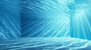 cycled 3d animation. Clear water inside the swimming pool, illuminated with sun rays going through the liquid surface. Underwater caustic effect