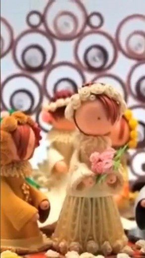 A paper quilled wedding scene