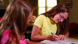 Mother Helps Daughter With Homework Stock Footage SBV-300230766 - Storyblocks