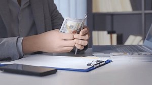 Financial Crisis and Money Calculation , Witness the calculation of money amidst a financial crisis, emphasizing the importance of financial planning and management during challenging times