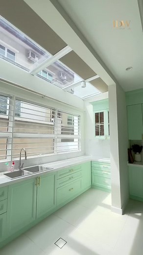 Modern Kitchen with Mint Green Cabinets and Natural Light