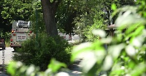 Detroit Fire trucks extinguishing a fire in a residential neighborhood.