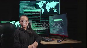 Asian Young Girl Hacker Hacking With Multiple Computer Screens And Pose In Dark Room