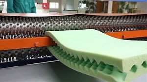 clip-1013238449-machine-foam-rubber-cutting-factory-on-production