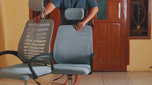 Adjusting an Ergonomic Office Chair in a Modern Room