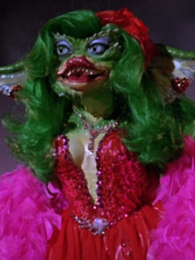 Greta Gremlin's Nostalgic Performance in Red Ballgown