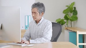 clip-1101744959-elderly-man-using-computer
