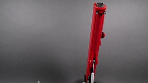 Superstructure strength test of my Liebherr LTM 1250-5 model. The boom consists of outer section (not complete yet, but strong enough to stay together) with one inner section inserted for extra weight. I've put 480 grams of counterweight in form of weighted LEGO bricks at the back of the turntable, and there are two small hard shock absorbers behind the boom that act as dampeners/pushers when lowering/raising. | Sariel's Bricks & Pets