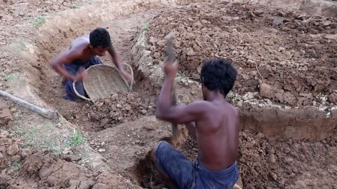 Stone and Clay Shaped Into a Stunning Fish Pond Built by Hand in Just 2 Weeks