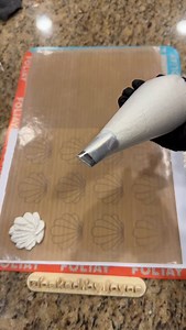 HELPFUL TIPS ✅ Textured Seashell Macarons Let’s get right to the tips: - Shell template available on Etsy at Baked By Joyce (or comment SHELL TEMPLATE for link) - Use a petal piping tip - Undermix your batter: all dry ingredients mixed in then fold and smash a few times. The batter should not run at all - Hold and pipe the batter at an angle (I’ll post a real time piping video tomorrow) - Don’t bang or tap the tray, you’ll cause the batter to lose its shape - Use a toothpick or scribe tool to ON