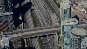 A view of Toronto's rail and highway transportation arteries seen from a height. Overhead.