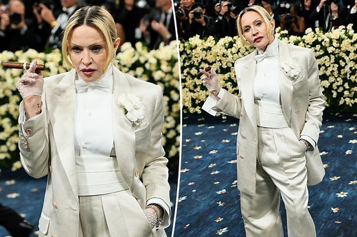 Madonna sports classic white tuxedo on the Met Gala 2025 red carpet — and carries a cigar