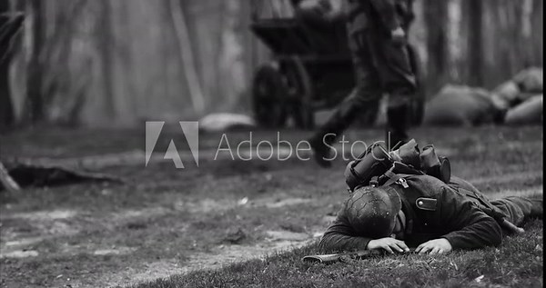 Historical Re-enactment Black And White Video. Re-enactor Dressed As German Wehrmacht Soldier Lies Slain In Reconstruction Of Battles World War Ii. German Soldier Uniform. German Infantry Soldier In