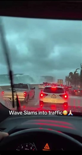 Ocean Wave Crashes Into Stopped Traffic