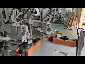 Clothes hanger labeling strapping machine