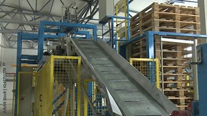 Packaging line for packaging finished products. Processing of potatoes. Production of starch. factory for the production of starch from potatoes. The interior of the enterprise. Chemical production