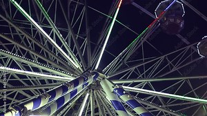 Ferris wheel in amusement park at night