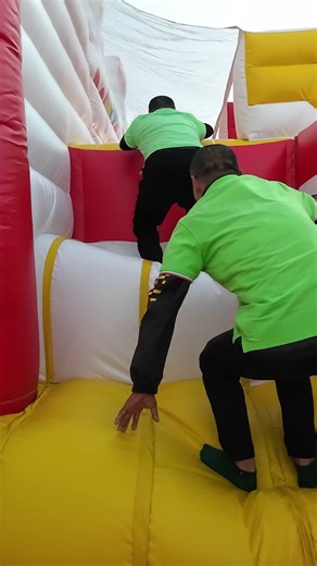 🎅 THIS SANTA INFLATABLE IS TOO FUN! Workers Can’t Resist Jumping On It!#christmas #santa #fun