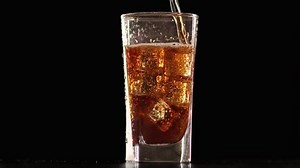 clip-1051470202-amazing-fresh-coke-bubbles-transparent-glassware-isolated