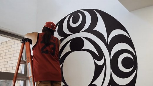 Coast Salish spindle whorl mural represents weaving traditions at Bellingham library