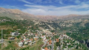 Lebanese village near the valley. Aerial footage of the town and valley. Best hiking trails. Middle East region. Summer vacation in Lebanon. Mountain trip. Village from bird's eye view