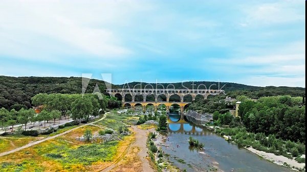 Aerial view of the aqueduct bridge with arched tiers in France. Drone view of Pont du Gard the highest Roman aqueduct bridge in the world.