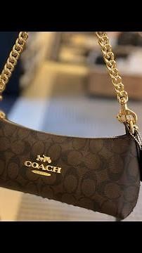 Coach Charlotte shoulder bag in signature canvas.