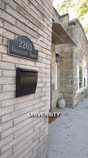 Luxury Homes & Design NC | Deline on Instagram: "✨ Architecture with Character ✨ Discover 2203 University Drive—an Art Deco-inspired 3 bedroom, 2.5 bath home in the heart of Forest Hills, Durham. Highlights include: 🔥 Classic fireplace in the open-concept living room 🍽️ Modern kitchen with quartz countertops & stylish cabinetry 🌀 Spiral staircase adding architectural charm 🏡 Finished lower level suite with private entrance—ideal for guests or multi-generational living 🌳 Fenced yard & landsc