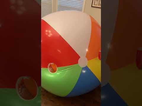 Deflating the huge pvc beach ball suit