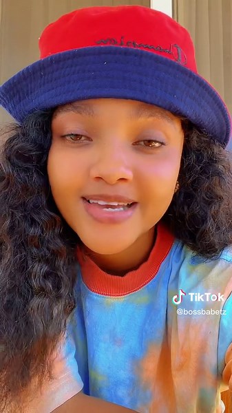 Colorful Fashion Statement with a Red Bucket Hat