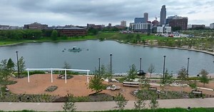 Omaha: Heartland of America Park at The RiverFront. Aerial view of green space and city skyline in O