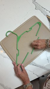 GENIUS kitchen hack‼️ Great way to recycle your clothing hanger in the kitchen. Would you try this when you are camping or in need of it? | Janelle & Kate