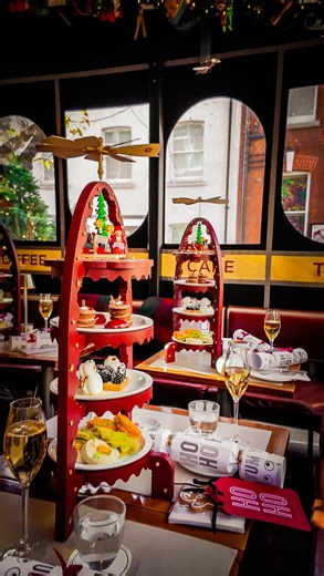 LONDON GASTRO BOY on Instagram: "#AnyaHindmarch 🎄 The @anyahindmarch Village, an annual December ritual. A place where whimsy and craftsmanship meet, and the season unfolds with quiet theatre. 🎄 Begin at @theanyacafe, the Village’s social heart. Festive Afternoon Tea arrives with a hint of mischief: mulled wine warming the hands, delicate seasonal cakes arranged on a sculptural stand inspired by Swedish angel chimes. A small celebration in every detail. 🎄 Step into Anya’s Grotto, a reimagined